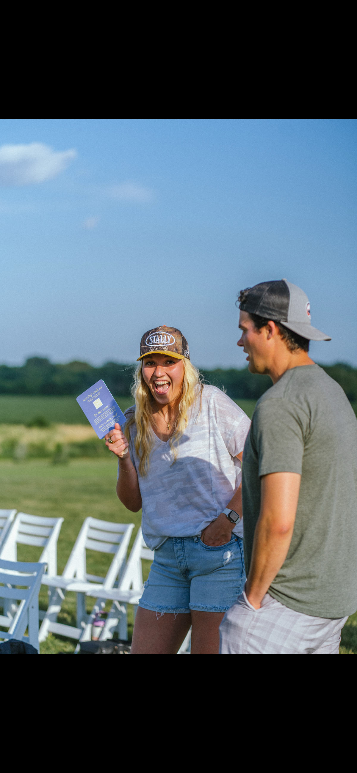 Woman wearing Camo Stally Hat outdoors at an event venue