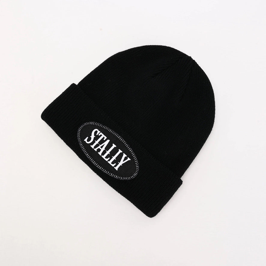 Black beanie with 'STALLY' logo on a white background
