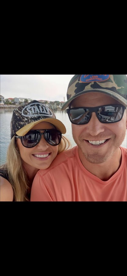 Woman wearing Camo Stally Hat near an ocean in Florida