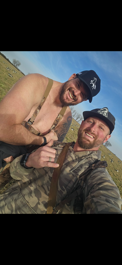 Man wearing OG Stally Hat while outdoors hunting 