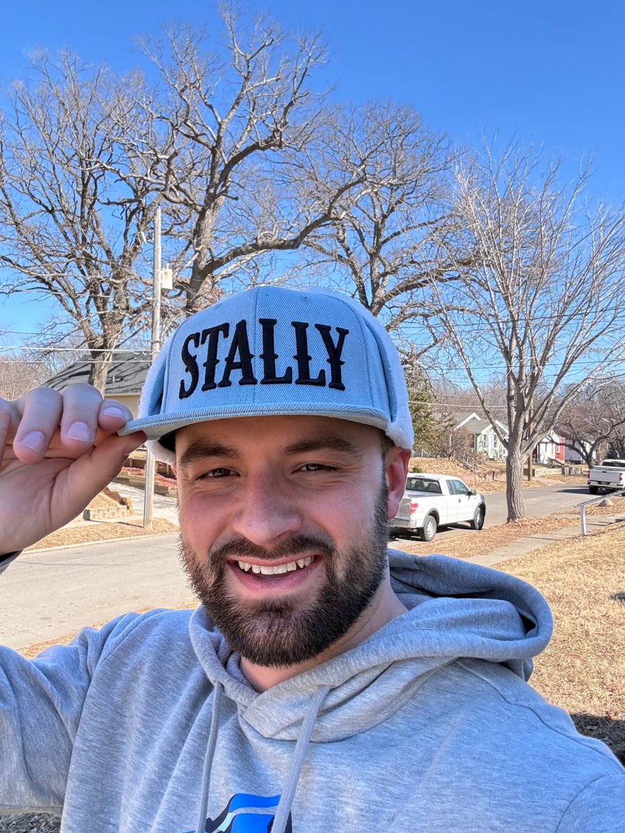 Man wearing STALLY Denim Ear Flap Trapper hat.
