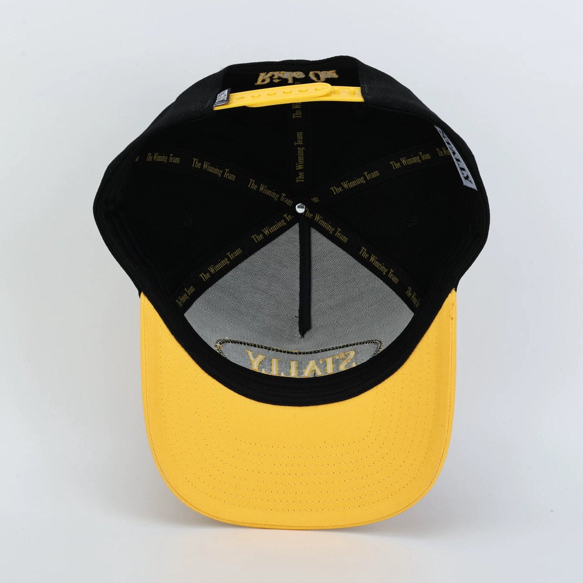 Underside of the black and gold Stally hat