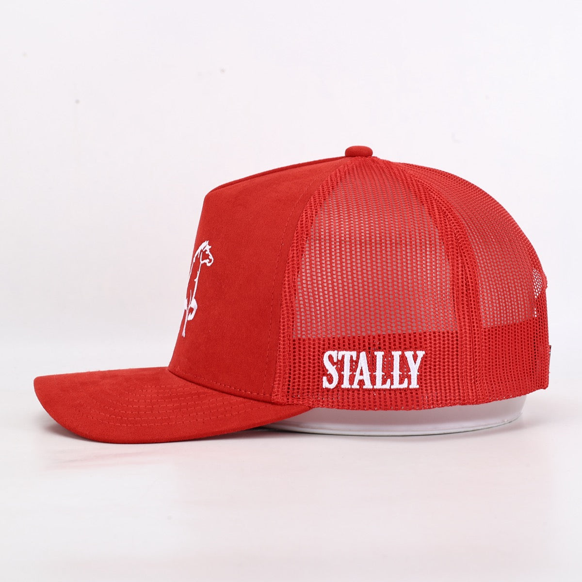 Red trucker cap with 'STALLY' branding on a white background