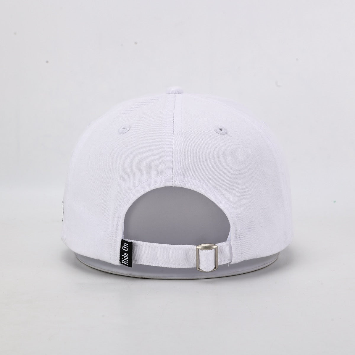 White cap with gray brim on a light gray background