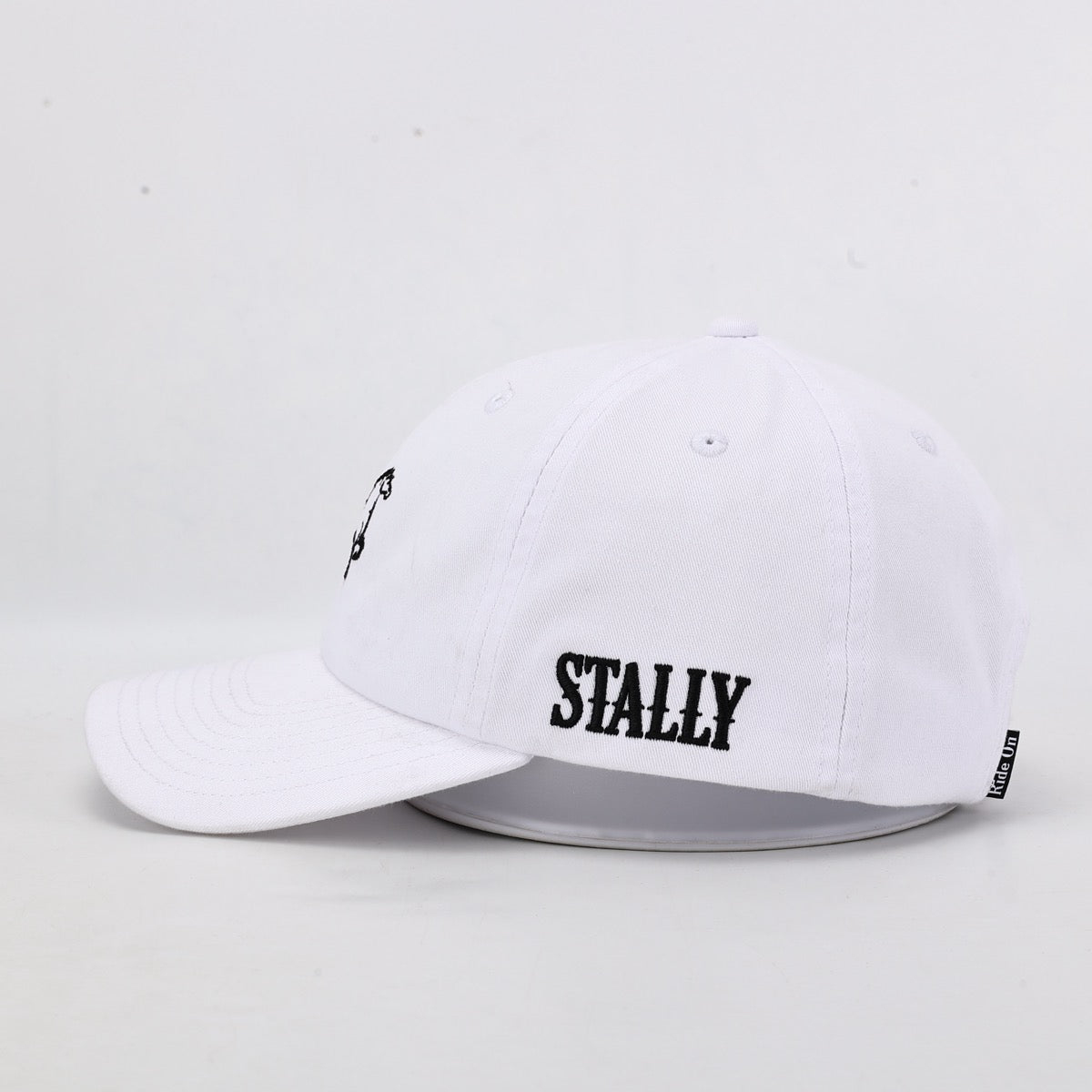 White cap with 'STALLY' branding on a light gray background