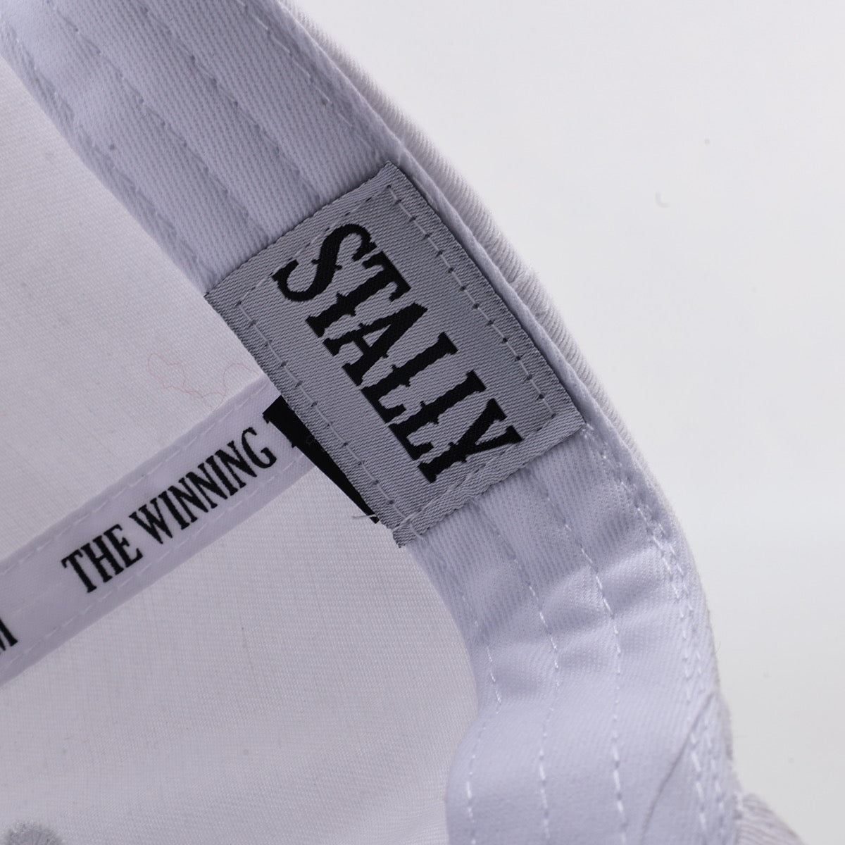 Gray cap with 'STALLY' label on a white background